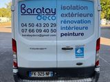 the back of a white van parked in a parking lot