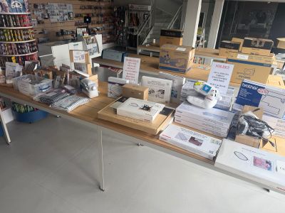a table with a lot of items on it in a store