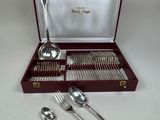 a box with silverware in it on a table