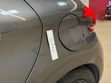 a car with a sticker on the side of it ' s door