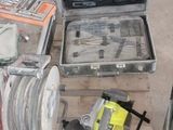a lot of tools that are sitting on the floor