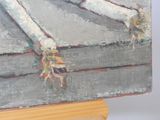 a picture of a painting on a wooden easel