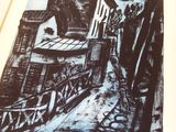 a black and white drawing of a building on a street
