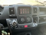 a dashboard of a truck with various gauges and controls
