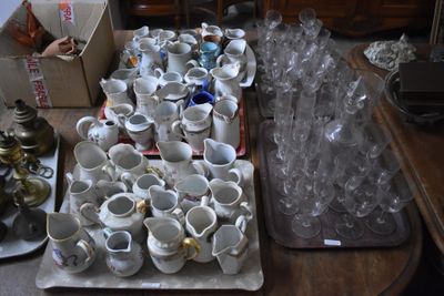 many cups and saucers sitting on a table