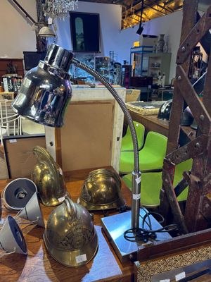 a table with a lamp and other items on it