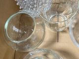 a lot of empty glasses sitting on a table