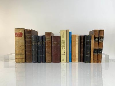 a lot of books that are lined up on a table