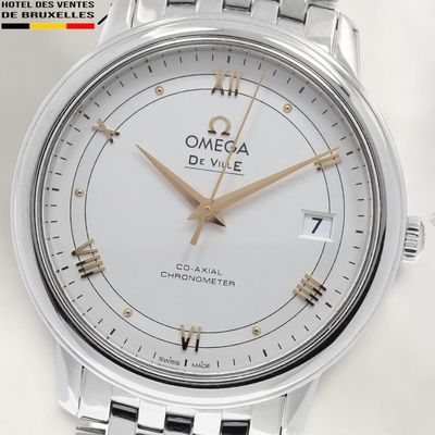 an image of a close up of a watch on a white surface
