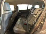 the back seats of a car are empty and the passenger seat is empty