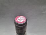 a close up of a bottle of wine on a table