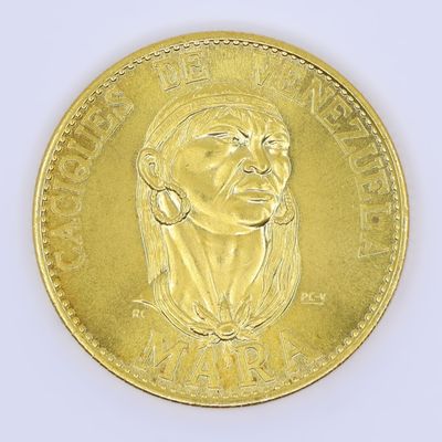an image of a gold coin with a woman ' s face on it