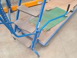 a picture of a large blue ladder in a warehouse