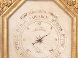 a gold clock with an eagle on top of it