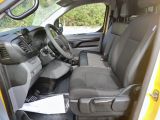 a yellow truck with a black seat and steering wheel