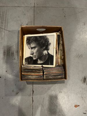 a box with a picture of a man in it on the floor