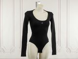 the bodysuit is black and has long sleeves on it