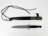 a knife and a cord on a white surface