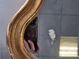 a person taking a picture of their reflection in a mirror
