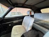 a black car with white seats in the back of it