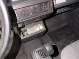 a car dashboard with a steering wheel and a control panel