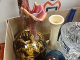 a box full of vases and other glass items on the table