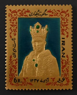 a close up of a stamp with a picture of a man wearing a crown