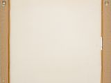 an empty picture frame with a piece of paper taped around it