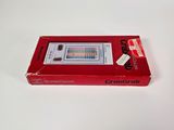 a red box with a game on it on a white surface