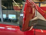 an image of a red car with a side view mirror