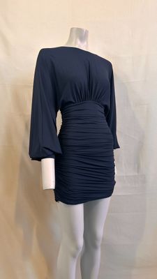 the mannequin is wearing a black dress and white tights