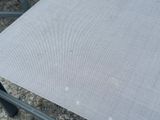 a piece of fabric on a chair that is sitting on the ground
