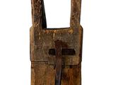 a wooden object with a cross on it on a white background