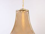 lamp hanging from a ceiling with a horse on the top of it
