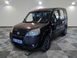 a small black van that is parked on a checkered floor