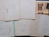 a lot of drawings that are on the table