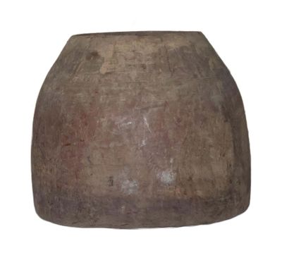 a large brown vase that is sitting on a white surface