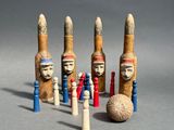 a group of wooden figurines of different shapes and sizes