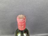 a bottle of wine that is sitting on a table