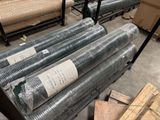many rolls of galvaniized wire in a warehouse