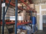 many boxes on the shelves in the warehouse