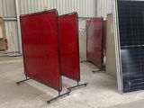three panels of solar panels in a warehouse