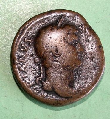 an old coin with a picture of a man on it