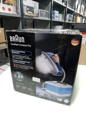 packaging of a braun steam cleaner in a box on a table