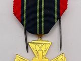 a close up of a medal with a cross on it