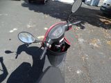 a motor scooter parked on the side of the road