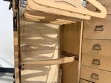 a wooden cabinet with a wooden hanger on it