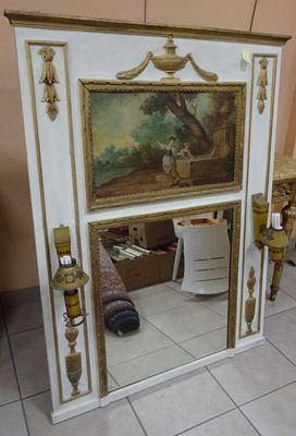 a picture of a mirror with a painting on it