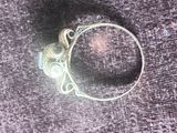an image of a silver ring with a stone in the middle
