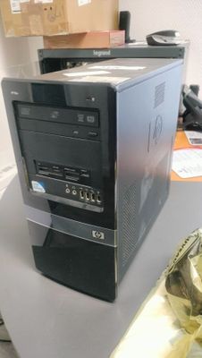 a desktop computer sitting on a table in a room